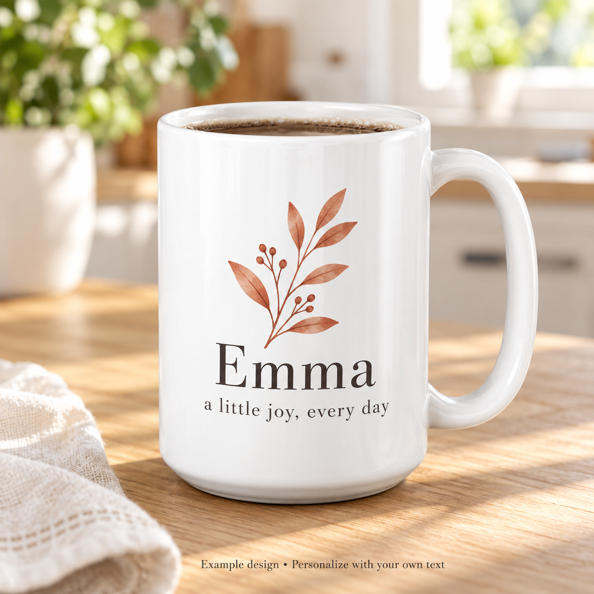 Personalized white ceramic mug with Emma text and botanical artwork shown as an example design
