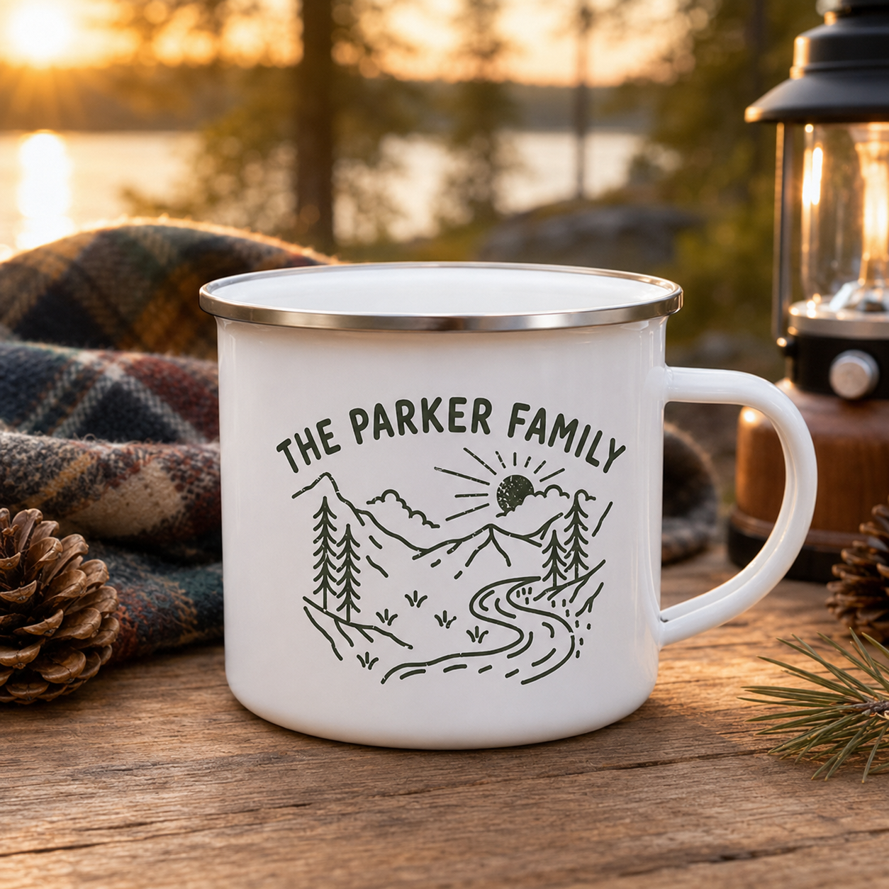 Personalized family enamel camping mug at a lakeside campsite