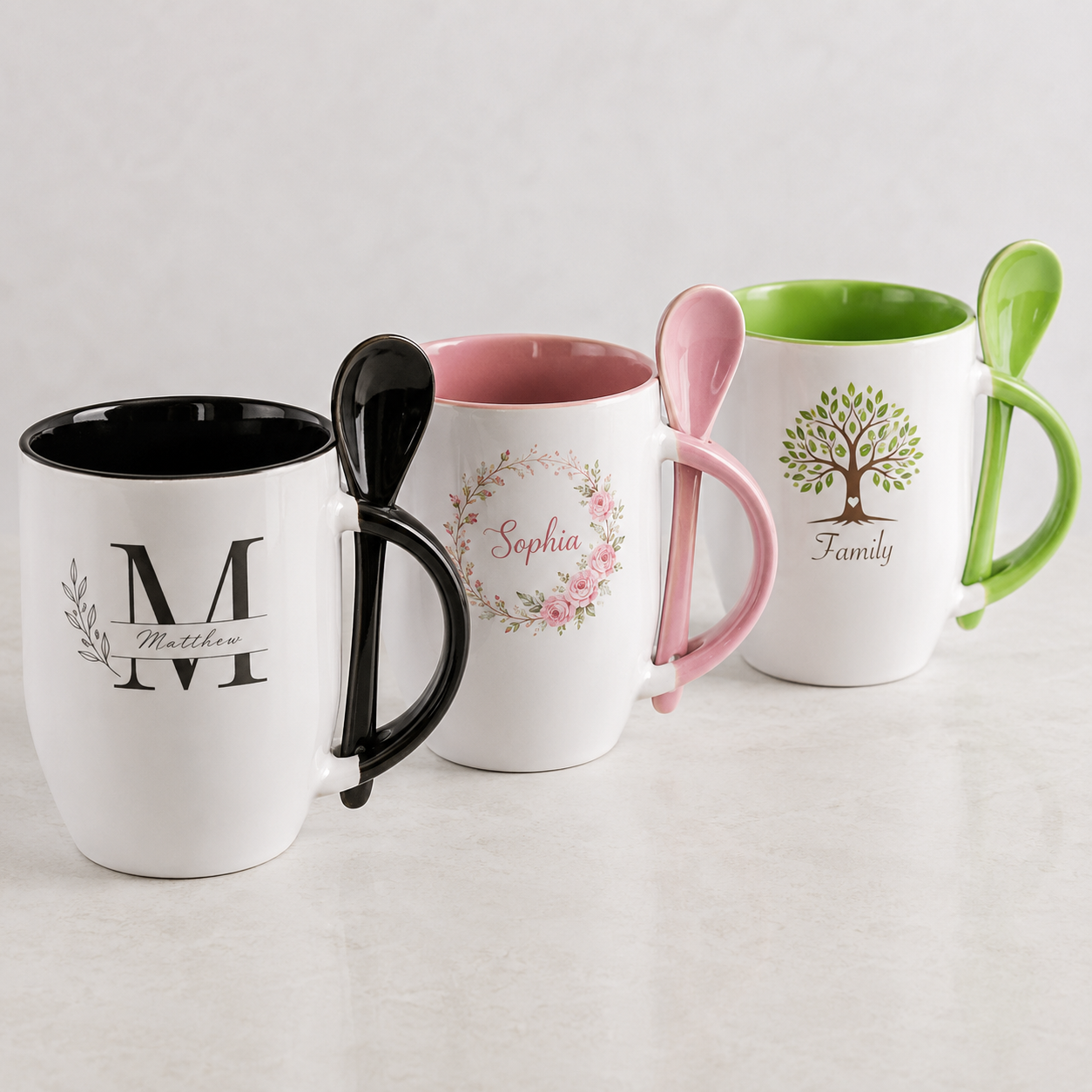 Black pink and light green personalized ceramic mugs showing matching spoons