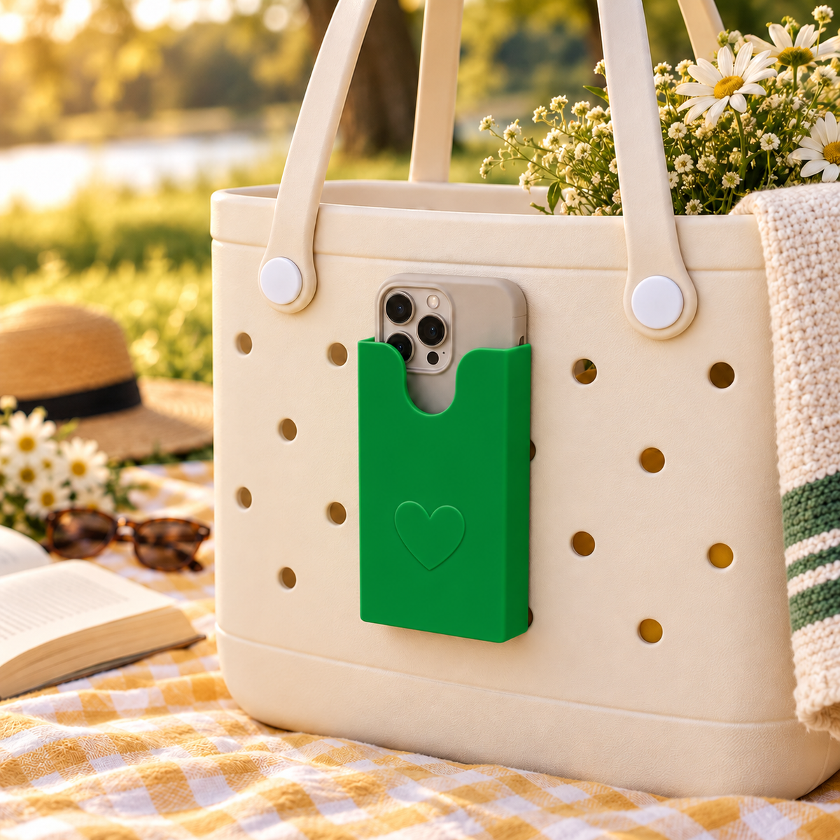 Deep green phone holder mounted on cream perforated tote