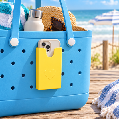 Yellow phone holder mounted on blue perforated tote